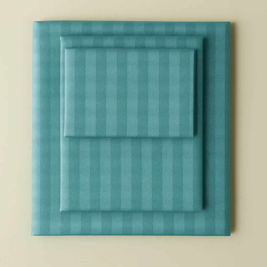 Supreme Rest turquoise striped bedding set neatly folded – eco-friendly custom sheets and pillowcases for stylish, sustainable sleep.