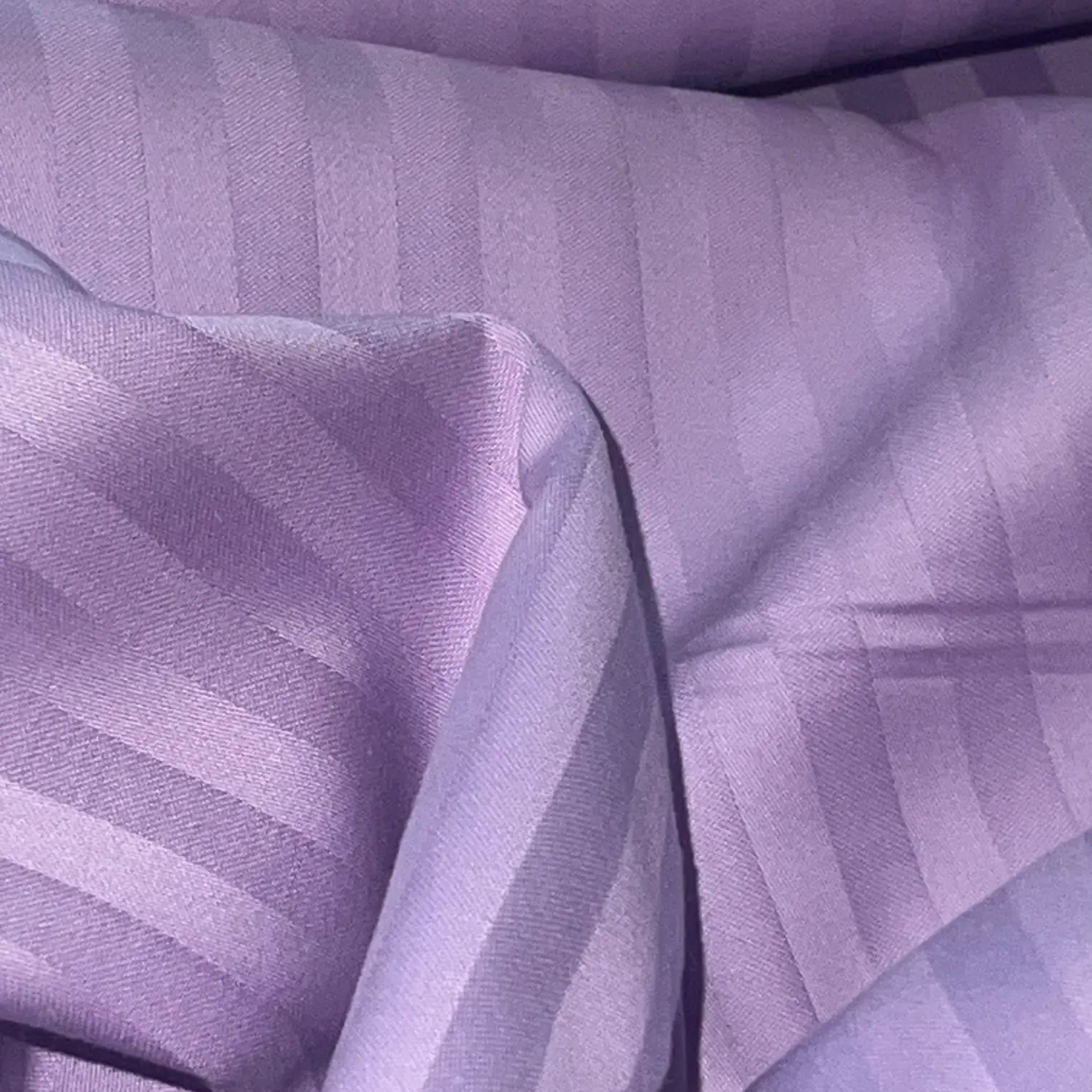 Close-up of Supreme Rest eco-friendly custom-made lavender stripe sateen bedding – soft, luxurious fabric for premium sleep comfort.
