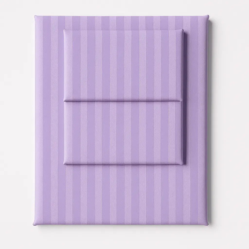 Folded lilac stripe sateen sheet set with a silky finish, offering a luxurious and refined bedroom look.