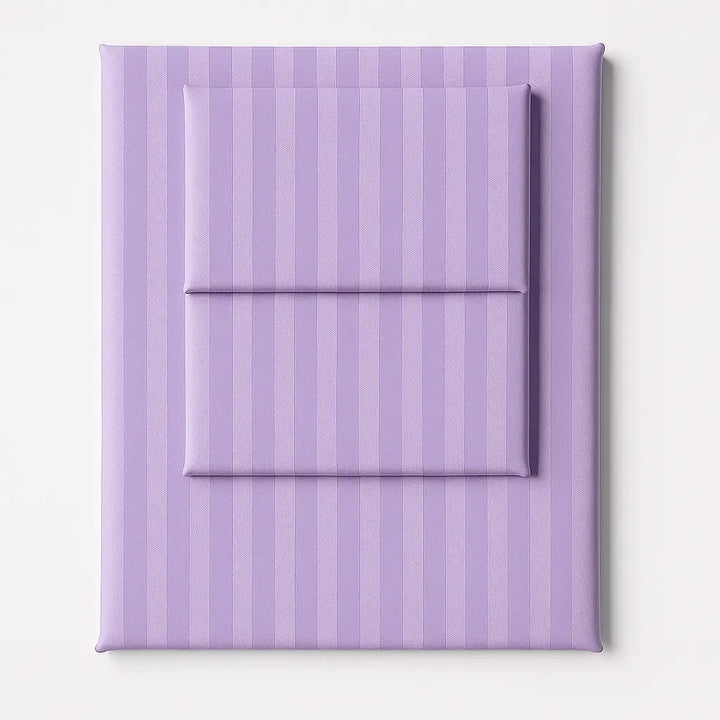 Folded lilac stripe sateen sheet set with a silky finish, offering a luxurious and refined bedroom look.